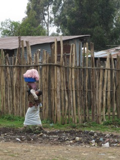 A woman walking down the street in Entoto, outside of Addis